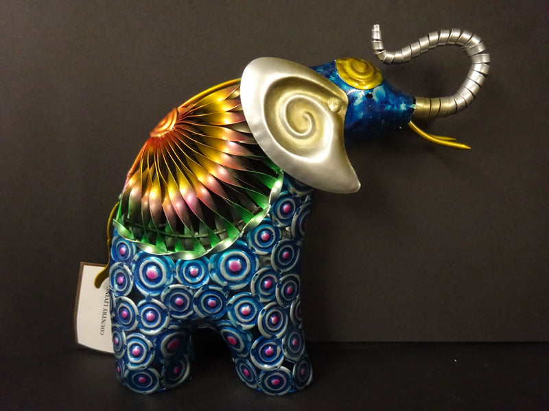 A hand painted metal Standing elephant figurine